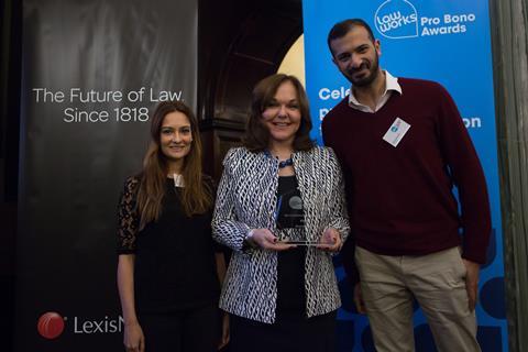 Best Contribution by an In-House Team  Nadine Morgan and Mohammed Karim, Microsoft Limited, receiving the award from Hilarie Bass (President, American Bar Association)